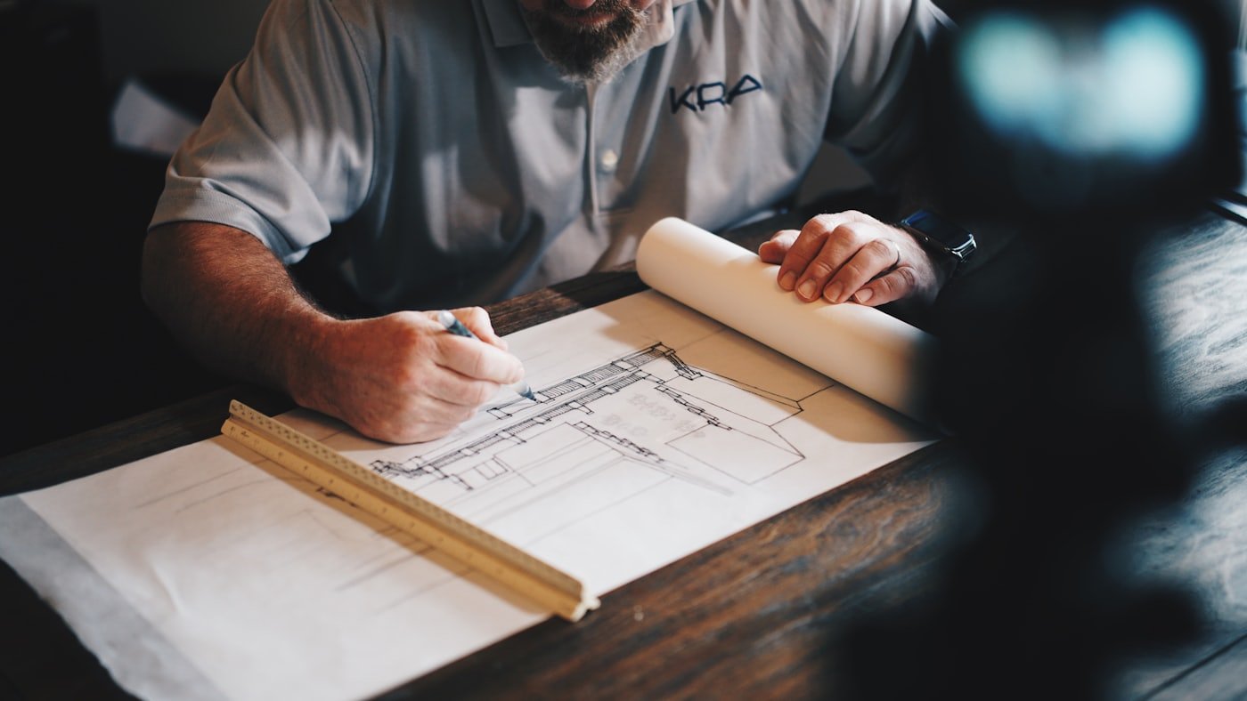 Builder working on plans